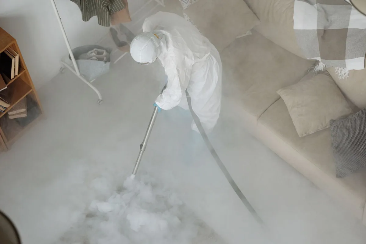 Biohazard cleanup technician in protective equipment, Angola on the Lake, NY